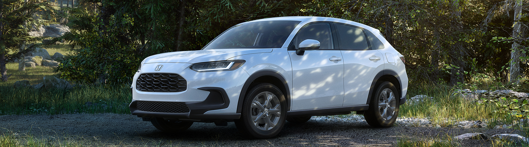 2026 HR-V in Platinum White Pearl parked in a very moody section of trees.
