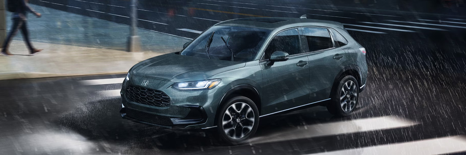 2026 Honda HR-V driving on a street on a rainy day