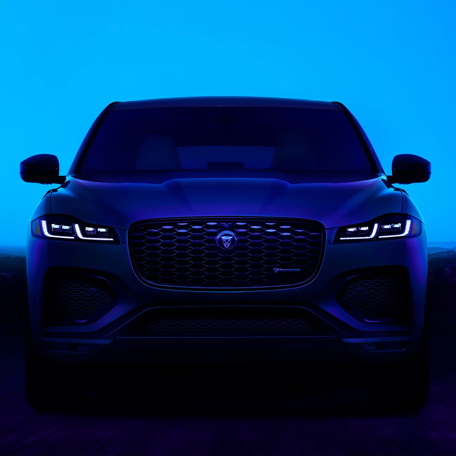 Front view of the Jaguar F-PACE in a blue studio setting
