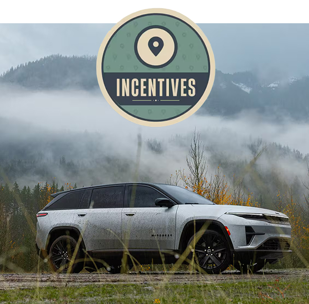 A new Wagoneer L 4Xe in a misty mountain landscape with an incentives pin graphic.
