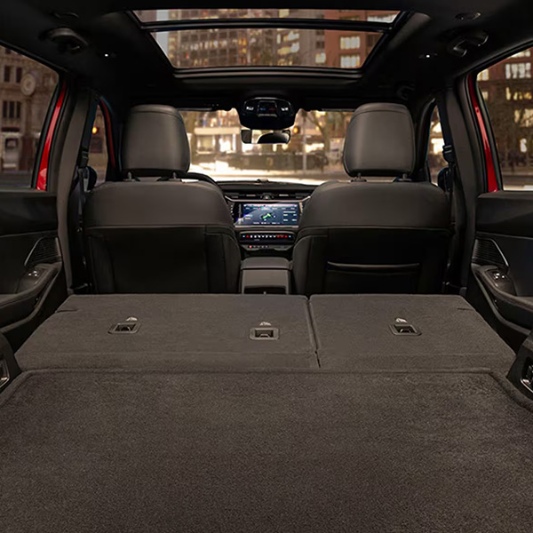 Interior view of the 2026 Jeep Cherokee cargo area with rear seats folded down.