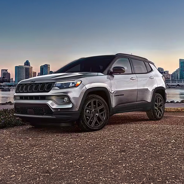 Front 3/4 shot of the 2026 Jeep Compass parked overlooking city