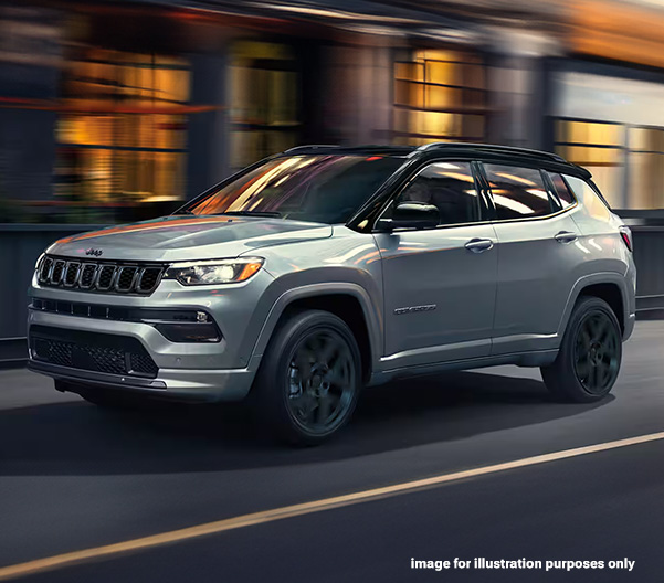 Exterior shot of a Jeep Compass driving in a city. Image for illustration purposes only.