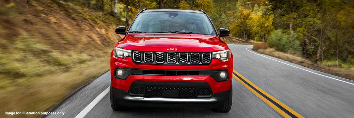 Exterior shot of a Jeep Compass driving with trees in the background. Image for illustration purposes only.