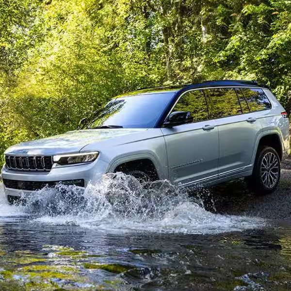 2026 Jeep Grand Cherokee driving through flooded water
