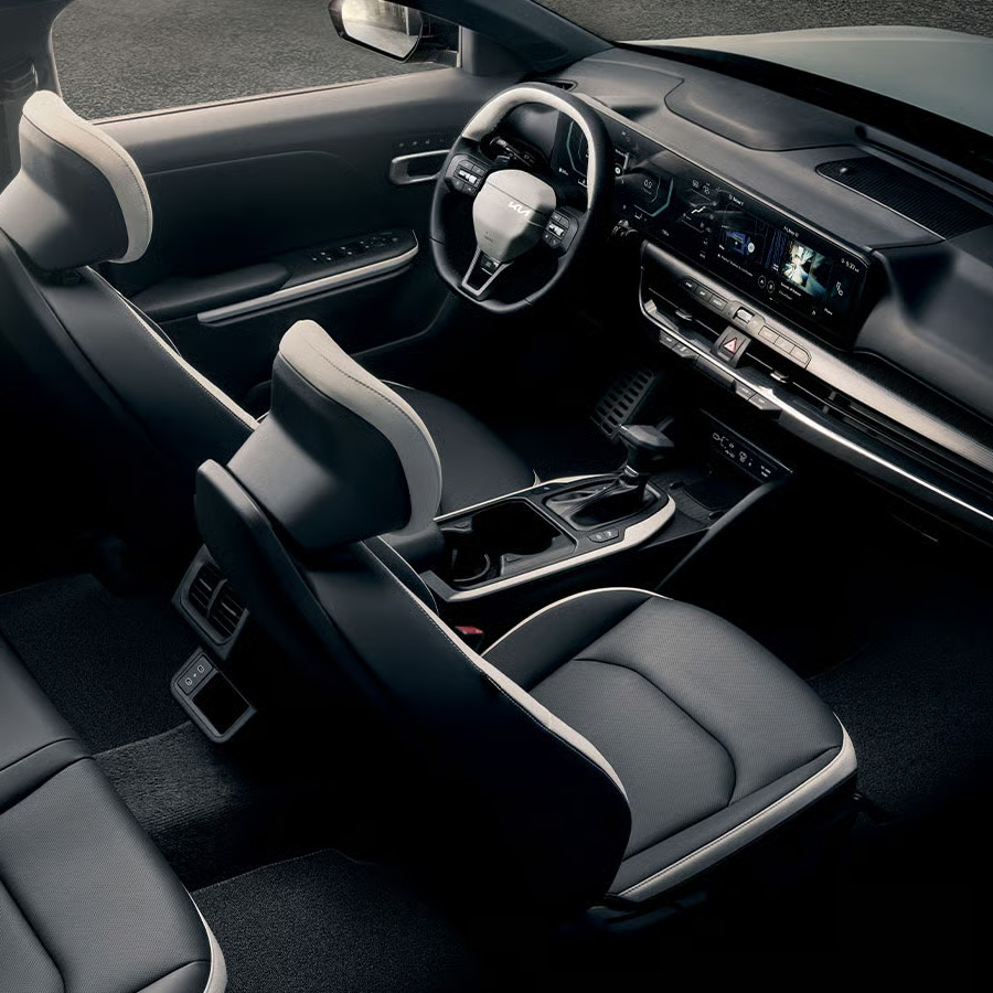 Interior overhead view of the 2026 Kia K4 sedan's accommodations, including ample legroom and headroom.