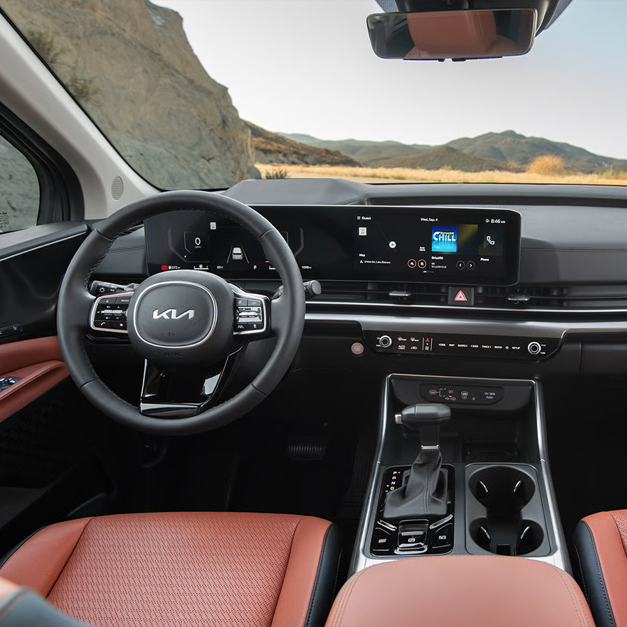 2026 Kia Carnival MPV interior, view of the front cabin and dashboard, including the Dual Panoramic Display