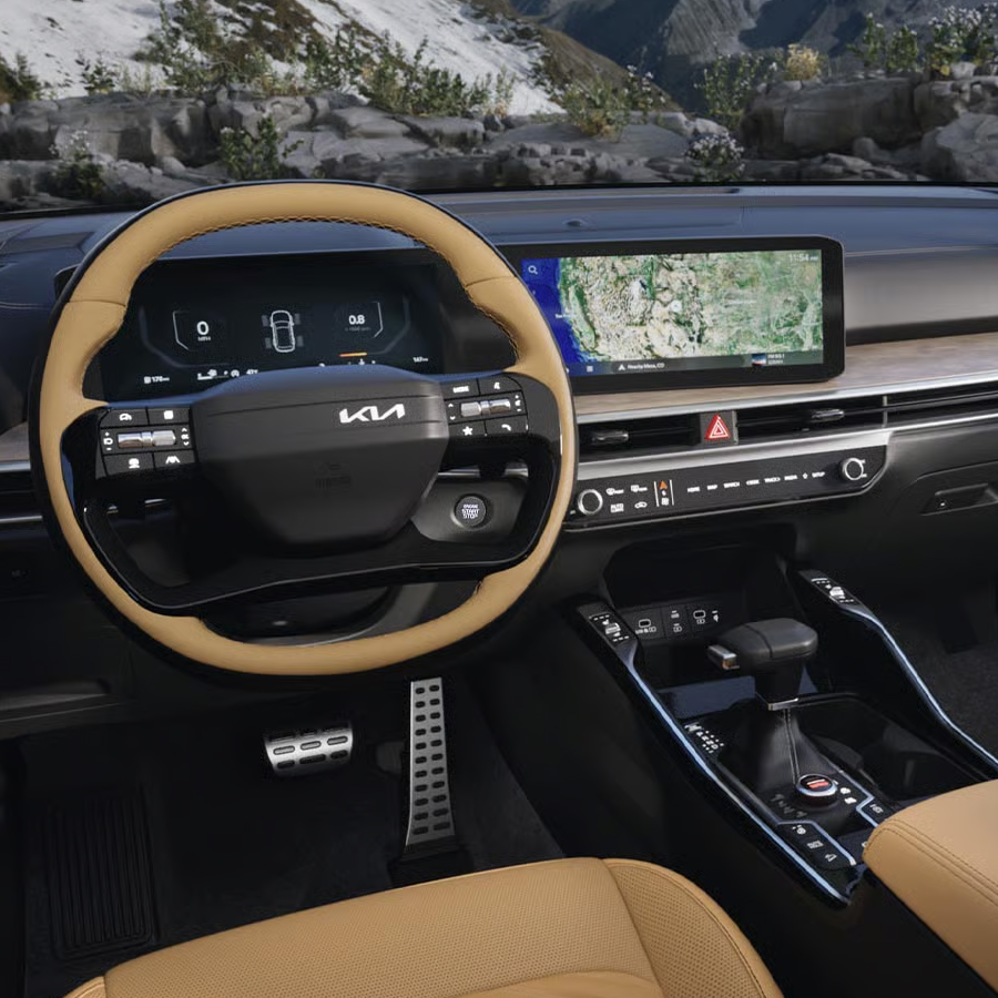2026 Kia Sorento X-Pro SX Prestige AWD interior, zoomed in on the pore wood interior trim and Dual Panoramic Display
