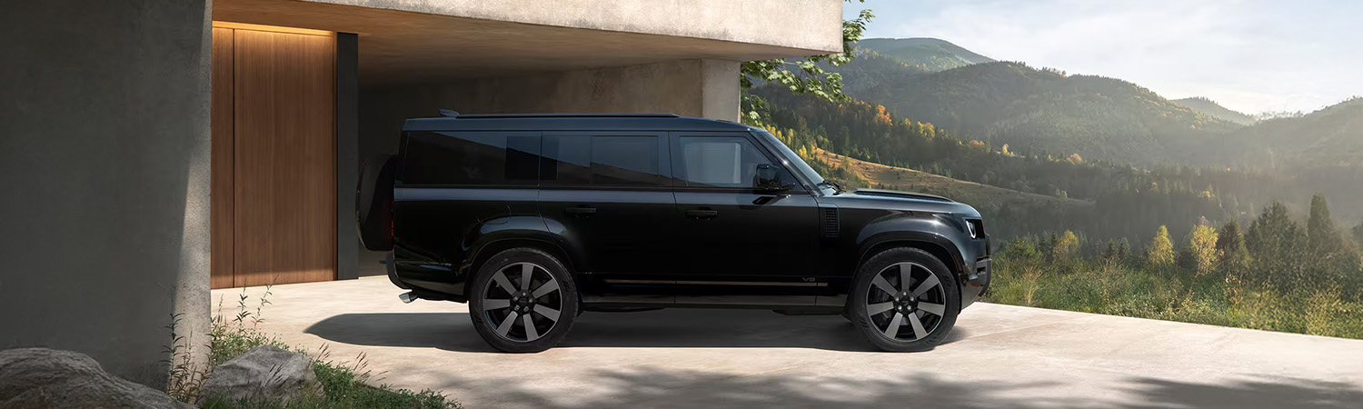 Side shot of the 2026 Defender 130 parked in front of home