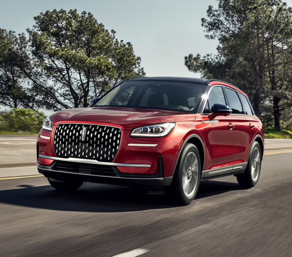 A 2026 Lincoln Corsair® SUV is being driven on a country road