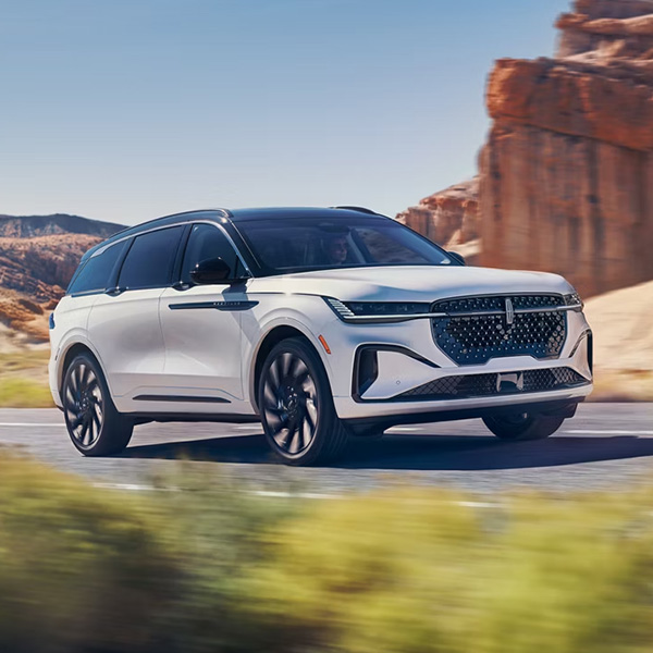 Side profile shot of the 2026 Lincoln Nautilus driving down road