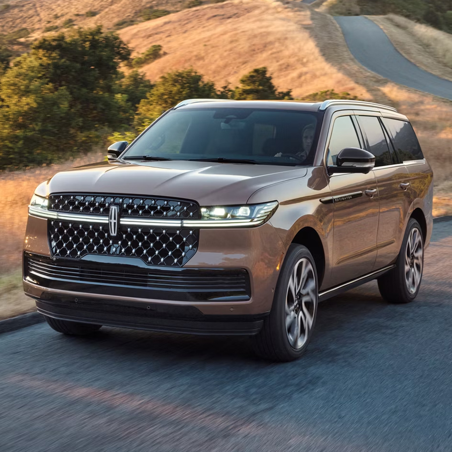 A 2026 Lincoln Black Label Navigator® SUV is being driven on a rural road