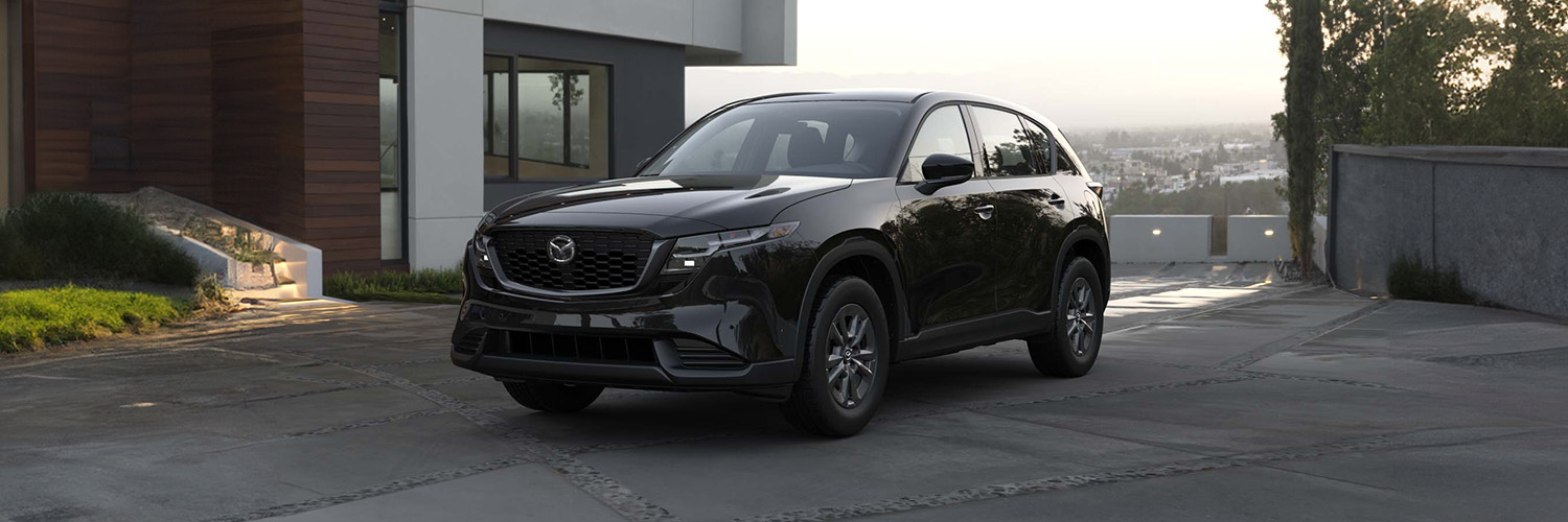 2026 CX-5 parked outside of a house