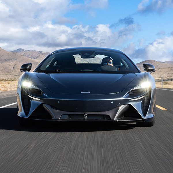 Head on shot of the 2026 McLaren Artura driving down road