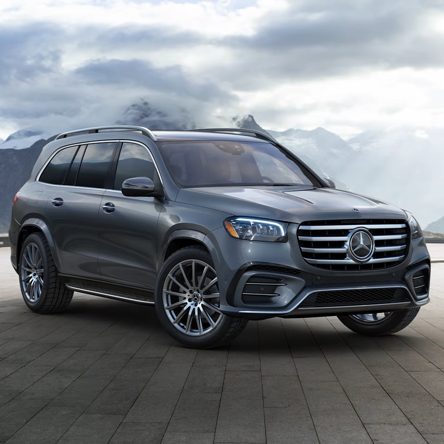 2026 Mercedes-Benz GLS luxury SUV in metallic gray parked on a scenic mountain overlook