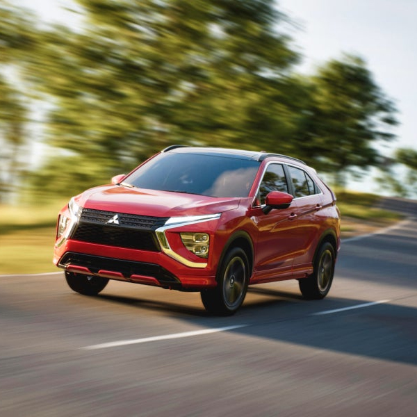 A red 2026 Mitsubishi Eclipse Cross Compact SUV with 1.5L direct-injection engine