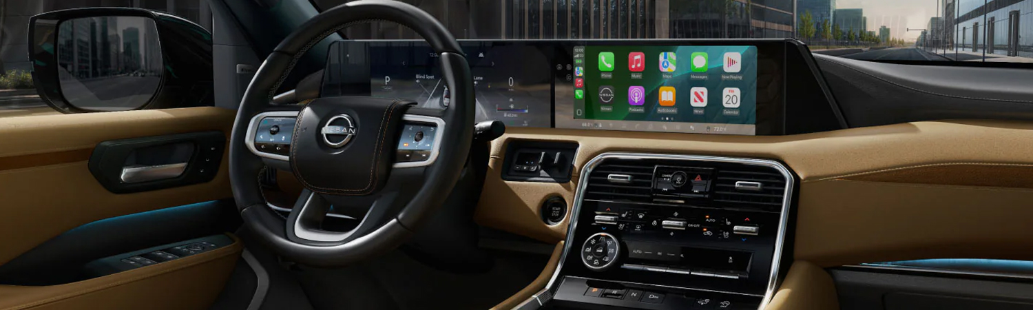 2026 Nissan Armada interior view showing steering wheel, dashboard, and center console