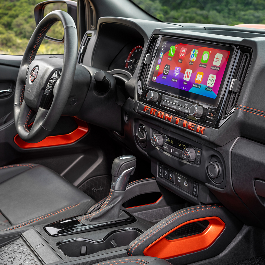 2026 Nissan Frontier interior view, showing desert mountains in the background