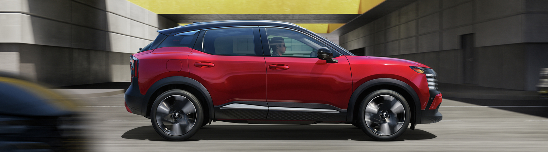 2026 Nissan Kicks SR, Scarlet Ember/Super Black, profile, action