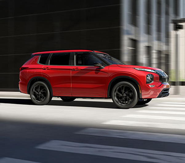 The 2026 Nissan Rogue Plug-In Hybrid driving in the city