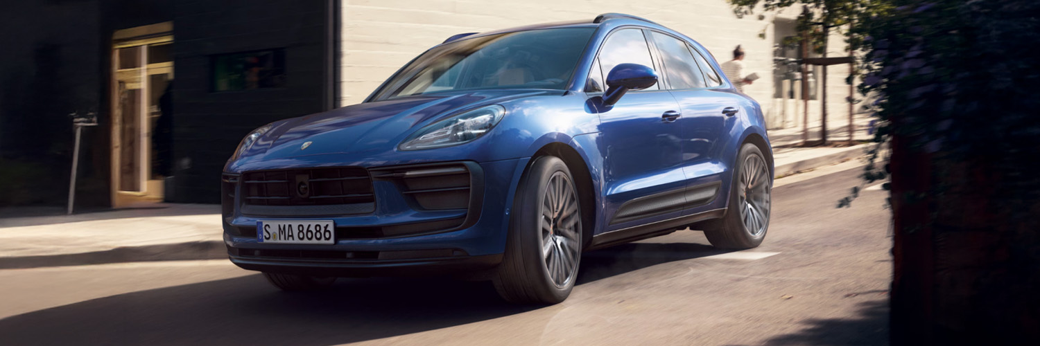 side shot of a blue Porsche Macan