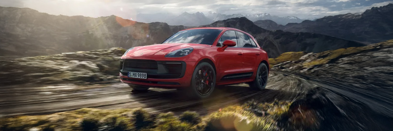 side shot of a red Porsche Macan