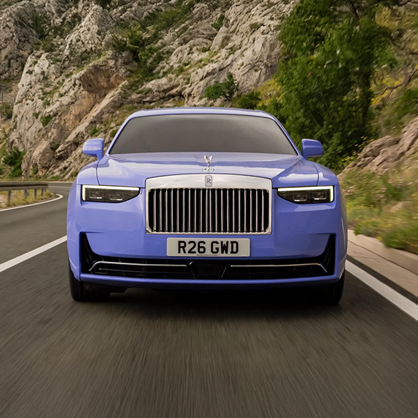 Head on shot of the 2026 Rolls-Royce Ghost driving down road