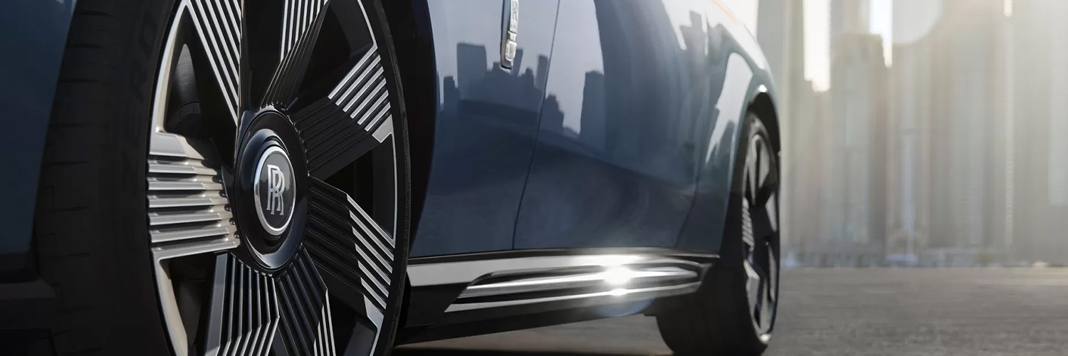 Up close shot of Rolls-Royce badge on wheel