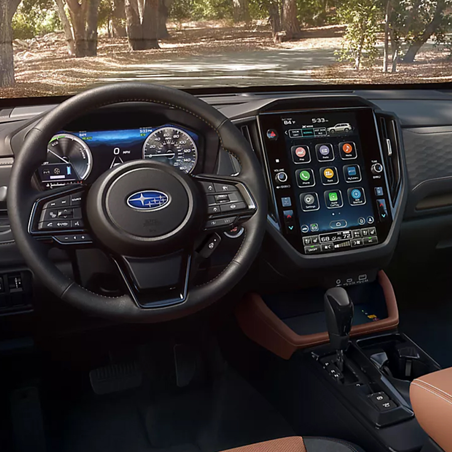 The interior of a 2026 Subaru Forester Hybrid from the driver's seat highlighting the leather trim.
