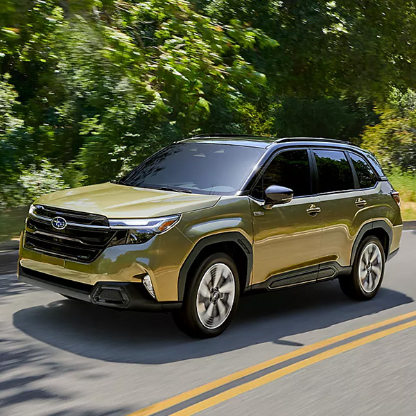 The 2026 Subaru Forester Hybrid driving on a road