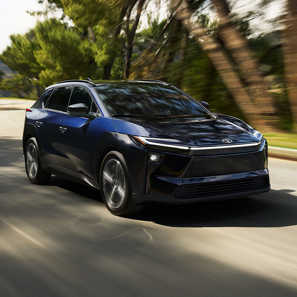 Front 3/4 shot of the 2026 Toyota bZ driving down road.