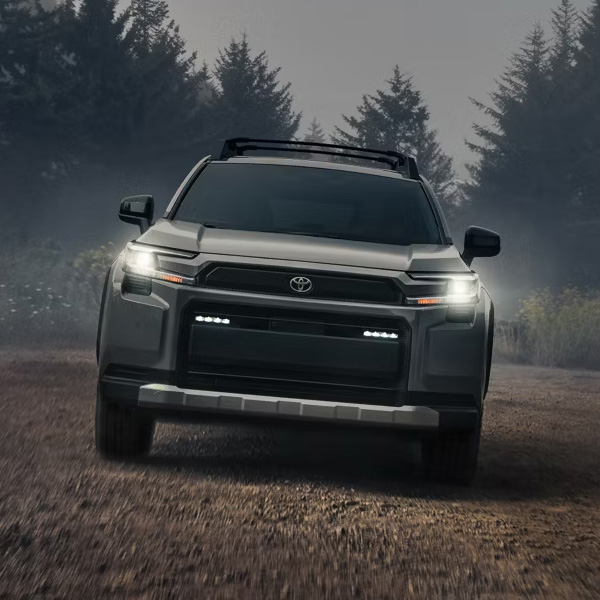 Head on shot of the 2026 Toyota RAV4 driving on dirt road