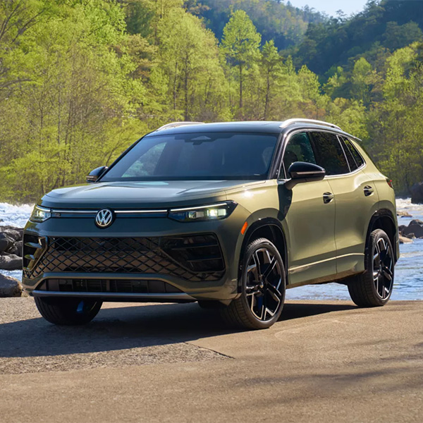 Exterior shot of a 2026 Volkswagen Tiguan parked in front of a river.