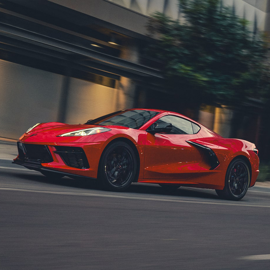 2027 Chevy Corvette Stingray Speeding Down a Road