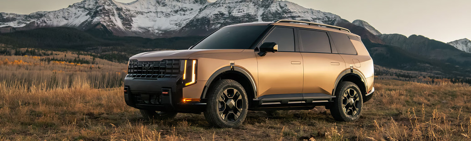 2027 Kia Telluride driving down a road