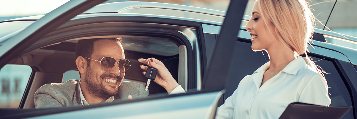 handing off car keys to new owner