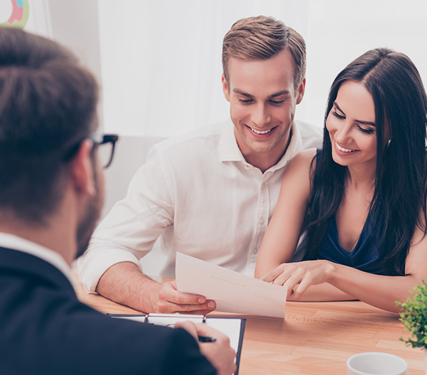 Successful lawyer giving consultation to family couple about buy