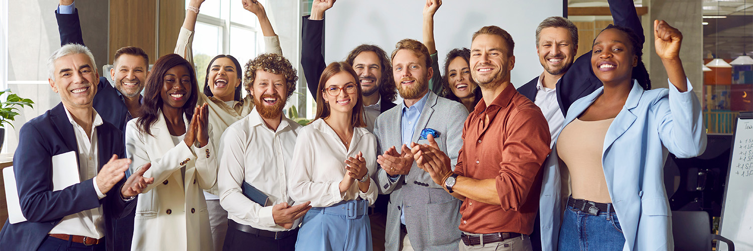 Group of people celebrating in office