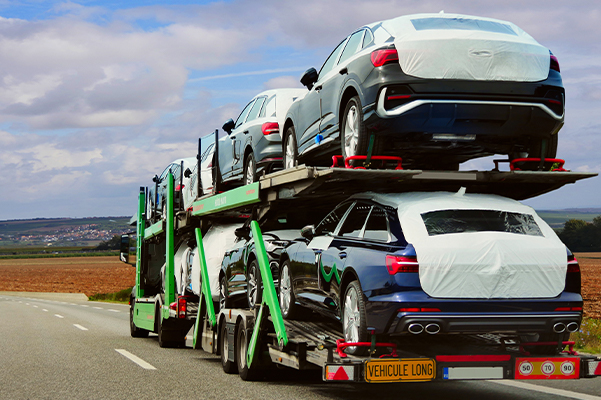 Car carrier truck transporting new vehicles on a highway