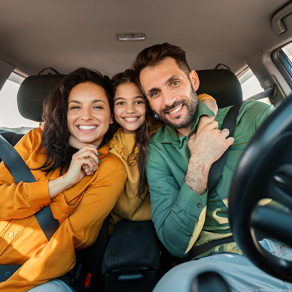 happy family in their new car