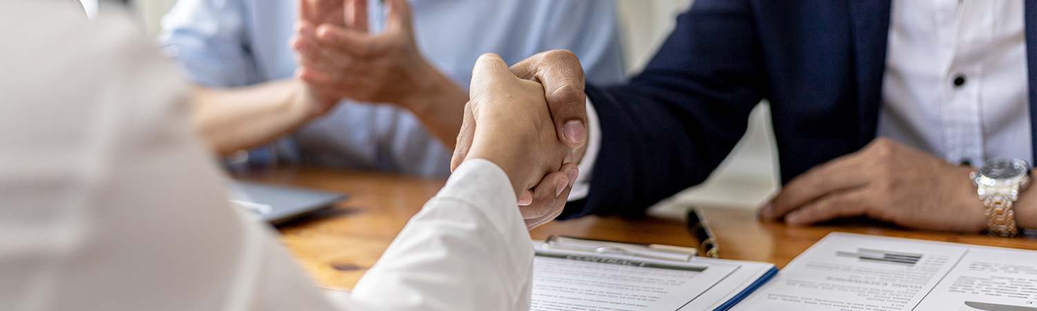 up close shot of people shaking hands