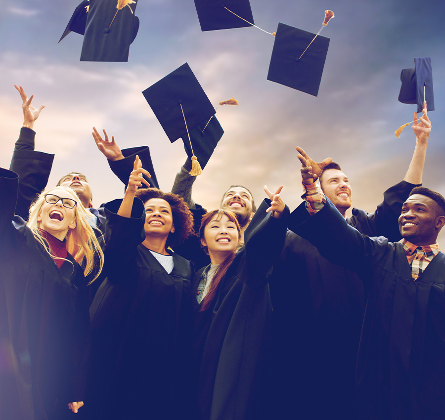 college students throwing up graduation caps