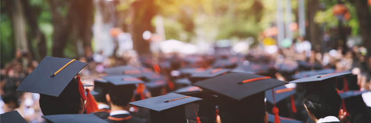 Group of college graduates in their caps and gowns