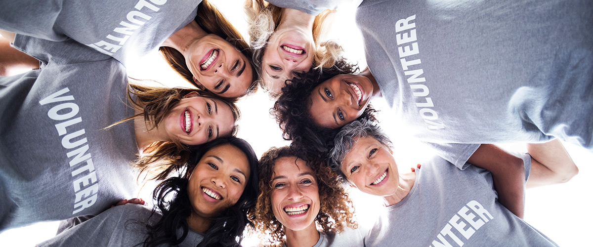 Happy circle of volunteers