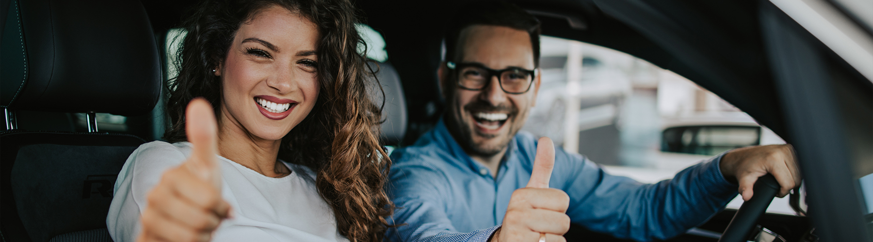 happy couple buyig new car