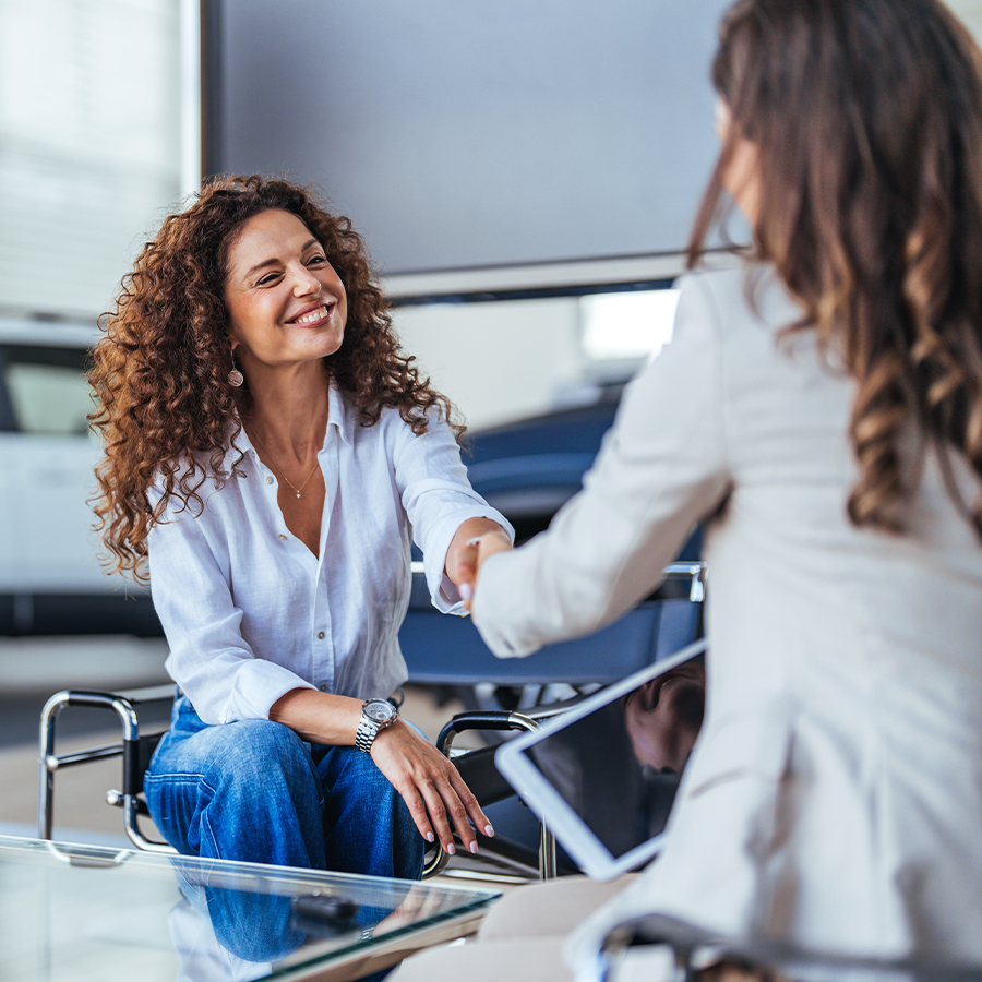 Woman shaking hands with finance expert