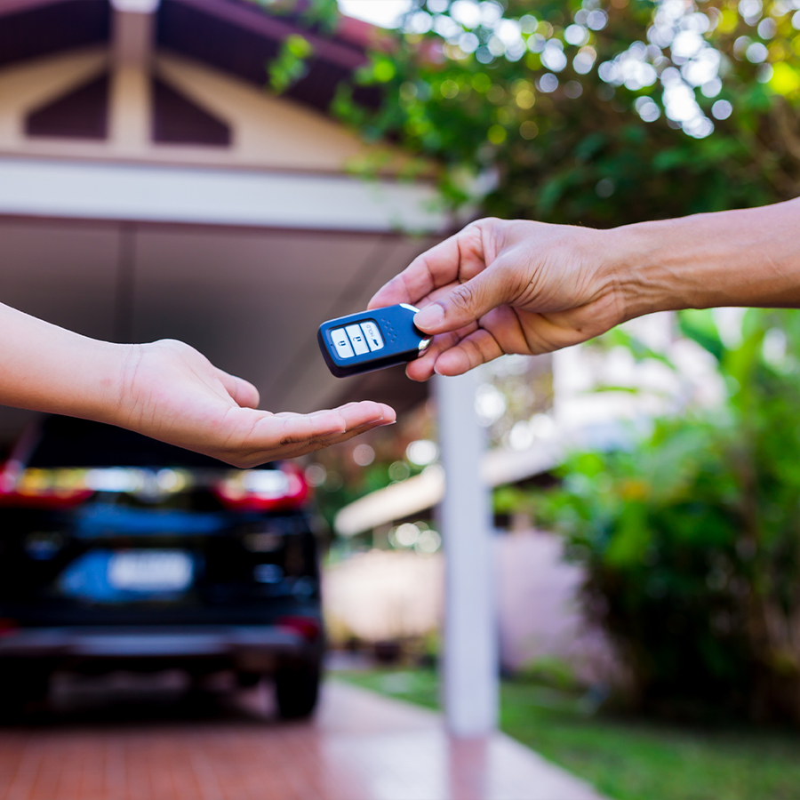 Handing over car keys at home