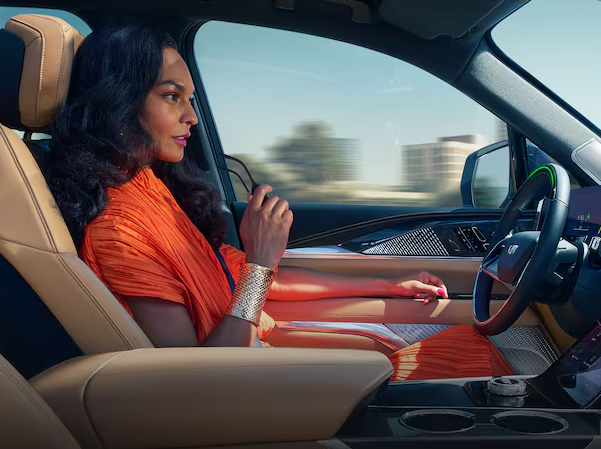 woman driving her Cadillac