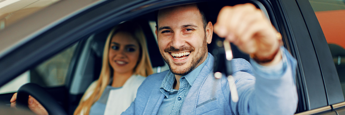 Man happy holding car keys