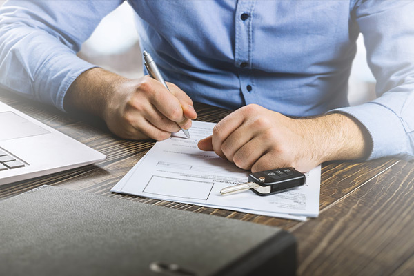 Man filling out paperwork